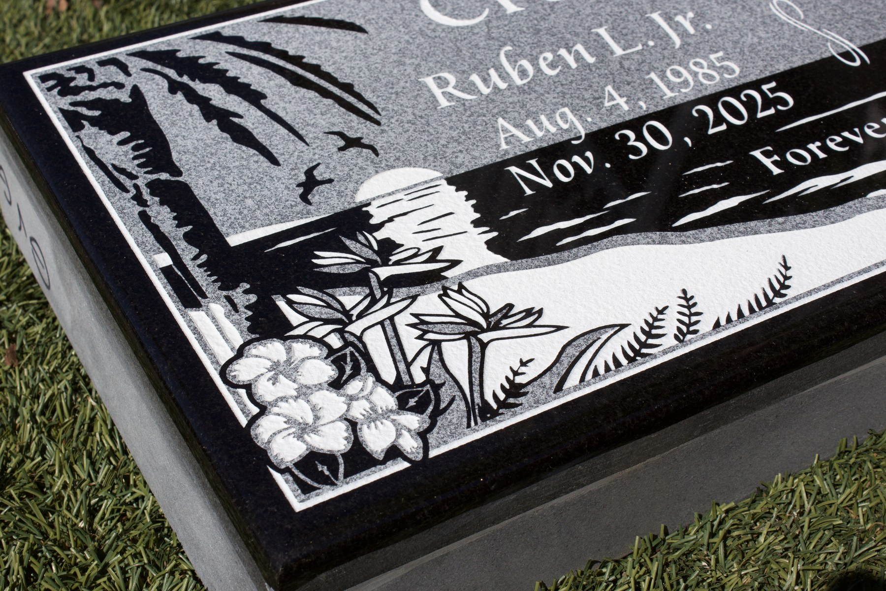 Custom polished black granite flat memorial with scenic artwork by GVG Memorials